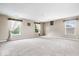 Spacious bonus room with carpet, multiple windows, and neutral walls at 8877 N White Tail Trl, McCordsville, IN 46055