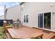 Cozy deck featuring outdoor seating, plants, and sliding glass doors to the home at 8877 N White Tail Trl, McCordsville, IN 46055