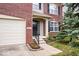 A close-up view of the front entrance with a well-manicured lawn and flower beds at 8877 N White Tail Trl, McCordsville, IN 46055