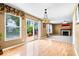 Open floor plan living room featuring a fireplace and a view of the back deck at 8877 N White Tail Trl, McCordsville, IN 46055