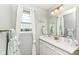 Bathroom with vanity, large mirror, and bright window at 9053 Fitzgerald Dr, Indianapolis, IN 46239