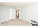 This bedroom has neutral paint, carpeted floors and an open door to the ensuite bathroom at 9053 Fitzgerald Dr, Indianapolis, IN 46239