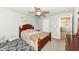Bedroom with wood furnishings, neutral carpet, and ceiling fan at 9053 Fitzgerald Dr, Indianapolis, IN 46239