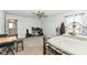 This cozy bedroom features neutral paint, a ceiling fan, carpet and an ornamental iron bed frame at 9053 Fitzgerald Dr, Indianapolis, IN 46239