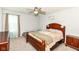 Bedroom with wood furnishings, neutral carpet, and ceiling fan at 9053 Fitzgerald Dr, Indianapolis, IN 46239