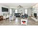 Spacious living room with a modern fireplace, stylish furnishings, and wood-look flooring at 9053 Fitzgerald Dr, Indianapolis, IN 46239