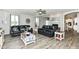 Comfortable living room featuring leather sofas, accent tables, and a decorative fireplace at 9053 Fitzgerald Dr, Indianapolis, IN 46239