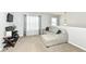The cozy loft includes a sectional couch and television set making it a comfortable area for relaxing at 9053 Fitzgerald Dr, Indianapolis, IN 46239