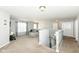 Spacious loft area offers a versatile living space with soft carpet, gray walls, and lots of light at 9053 Fitzgerald Dr, Indianapolis, IN 46239