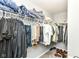 Walk-in closet with upper shelving and hanging clothes at 9053 Fitzgerald Dr, Indianapolis, IN 46239