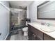 Modern bathroom featuring a glass enclosed shower, quartz countertop, and dark wood vanity at 919 Dreamy St, Greenwood, IN 46142