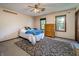 Neutral bedroom featuring a ceiling fan, plush rug, and windows bringing in natural light at 919 Dreamy St, Greenwood, IN 46142