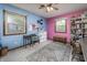 Colorful bedroom with blue and pink walls, chair, rug, and natural lighting at 919 Dreamy St, Greenwood, IN 46142