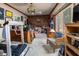 Versatile bonus room with neutral carpet, wood paneling and vintage stained-glass light fixture at 919 Dreamy St, Greenwood, IN 46142