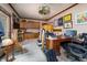 Multipurpose bonus room with desk, built in storage, and unique stained glass lighting at 919 Dreamy St, Greenwood, IN 46142