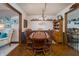 Charming dining room with wood table, chairs, vintage hutch and decorative wallpaper at 919 Dreamy St, Greenwood, IN 46142