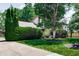 Pleasant front exterior featuring a stone accent wall, mature landscaping, and a well-maintained lawn at 919 Dreamy St, Greenwood, IN 46142