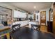 Charming kitchen featuring white cabinets, an island, and an adjacent dining area, perfect for Gathering meals at 919 Dreamy St, Greenwood, IN 46142