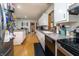 Well-lit kitchen with white cabinets, appliances, and dining area, ideal for preparing and enjoying meals at 919 Dreamy St, Greenwood, IN 46142