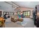 Spacious living room with large windows, comfortable seating, and a ceiling fan for added comfort at 919 Dreamy St, Greenwood, IN 46142
