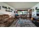 Comfortable living room featuring a large window, cozy seating, and a warm, inviting atmosphere at 919 Dreamy St, Greenwood, IN 46142