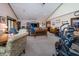 Large open living room with seating, dining table, and exercise equipment, suitable for relaxation and activities at 919 Dreamy St, Greenwood, IN 46142