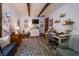 Cozy home office with wood beam ceiling, desk, and comfortable seating, a perfect workspace at 919 Dreamy St, Greenwood, IN 46142