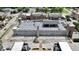 Aerial view of parking garage featuring solar panels in a commercial and residential district at 925 Veterans Way # 101, Carmel, IN 46032
