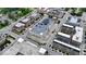 Bird's-eye view of a vibrant urban neighborhood featuring solar panels on top of parking structure at 925 Veterans Way # 101, Carmel, IN 46032