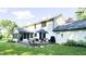 Large backyard with a tiered patio, seating, flower planters, and nice lawn at 9710 Iroquois Ct, Indianapolis, IN 46256