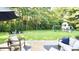 Expansive backyard featuring a patio, outdoor seating, play set, and green lawn at 9710 Iroquois Ct, Indianapolis, IN 46256