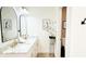 Bathroom with marble countertops, double vanity, and gold hardware at 9710 Iroquois Ct, Indianapolis, IN 46256