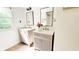 Dual vanities, framed mirrors, and modern fixtures enhance this bathroom at 9710 Iroquois Ct, Indianapolis, IN 46256