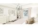 Bedroom with neutral tones, king size bed, and dresser with decorative accents at 9710 Iroquois Ct, Indianapolis, IN 46256