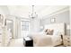 Spacious bedroom with tray ceiling, king bed, and natural light at 9710 Iroquois Ct, Indianapolis, IN 46256