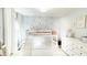 Adorable bedroom with a lofted bed, slide, and whimsical floral wallpaper at 9710 Iroquois Ct, Indianapolis, IN 46256