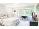 Bright bedroom with bay window, desk, neutral decor, and natural light at 9710 Iroquois Ct, Indianapolis, IN 46256