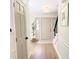 Inviting entryway with a neutral color palette, hardwood floors, staircase, and stylish front door at 9710 Iroquois Ct, Indianapolis, IN 46256