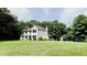 Charming two-story home with a well-manicured lawn and mature trees, perfect for outdoor enjoyment at 9710 Iroquois Ct, Indianapolis, IN 46256