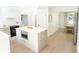 Spacious kitchen with an island featuring built-in microwave and ample storage at 9710 Iroquois Ct, Indianapolis, IN 46256