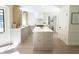 Open-concept kitchen with a large island, modern cabinetry, and ample natural light at 9710 Iroquois Ct, Indianapolis, IN 46256
