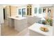 Bright, modern kitchen featuring custom cabinets, a spacious island, and sleek countertops at 9710 Iroquois Ct, Indianapolis, IN 46256