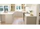 Well-appointed kitchen featuring custom cabinetry, quartz countertops, and modern appliances at 9710 Iroquois Ct, Indianapolis, IN 46256