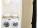 Efficient laundry area with front load washer and dryer set and neutral baskets at 9710 Iroquois Ct, Indianapolis, IN 46256