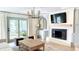 Relaxing living room with a fireplace, patio access, and comfortable seating at 9710 Iroquois Ct, Indianapolis, IN 46256