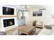 Comfortable living room with a fireplace, TV, and neutral-toned furniture at 9710 Iroquois Ct, Indianapolis, IN 46256