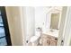 Modern powder room featuring a vanity, stylish mirror, and neutral decor at 9710 Iroquois Ct, Indianapolis, IN 46256