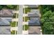 Neighborhood aerial view showing the layout of residential homes and green spaces at 9735 Woodsong Ln, Indianapolis, IN 46229