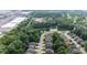 Scenic neighborhood with a pond, surrounded by lush greenery and commercial areas at 9735 Woodsong Ln, Indianapolis, IN 46229