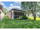 Well-maintained backyard with a screened-in porch offering serene outdoor living at 9735 Woodsong Ln, Indianapolis, IN 46229